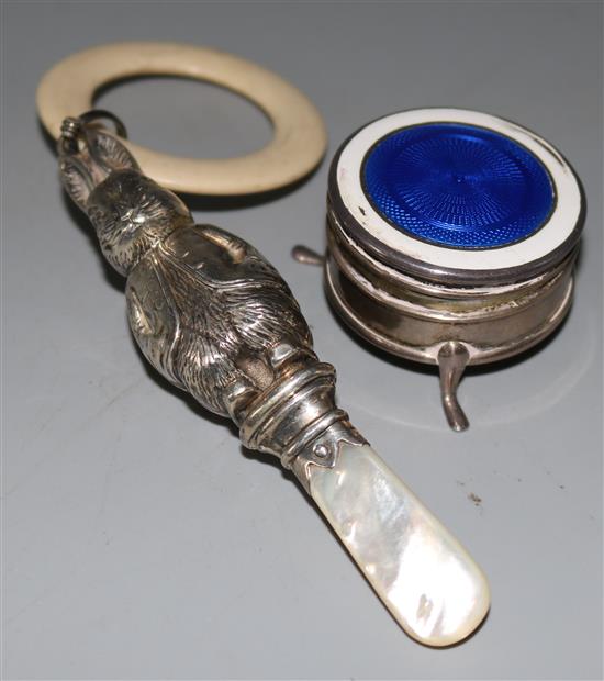 Silver and enamel pill box and a silver and mother of pearl childs rattle